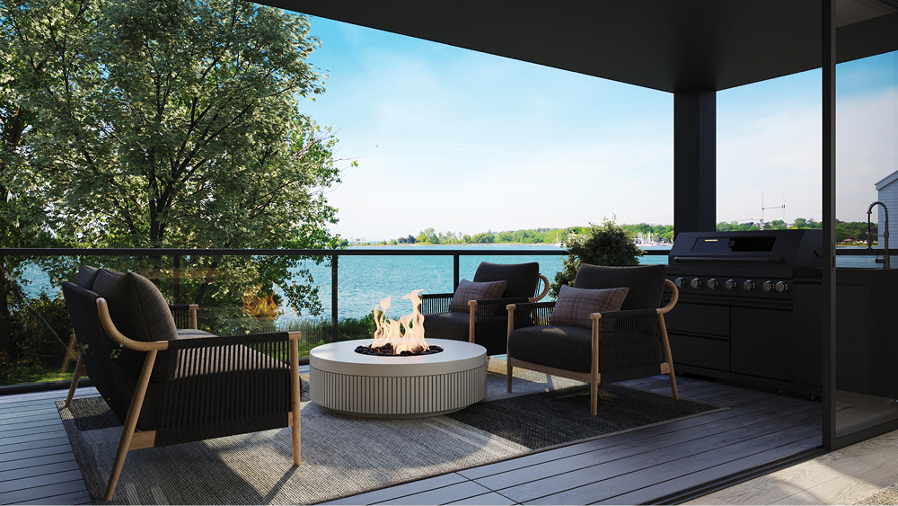 Outdoor patio with fire pit, lounge chairs, and waterfront view.