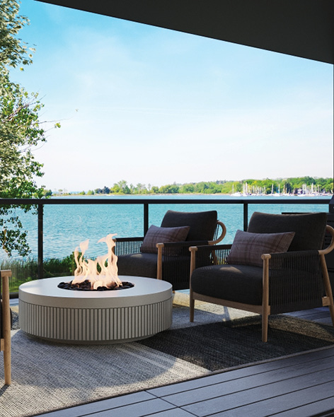 Waterfront deck with fire pit at dusk